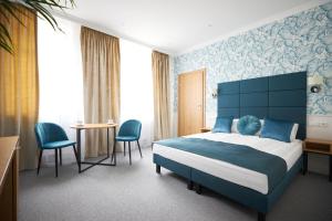 Posteľ alebo postele v izbe v ubytovaní Apartamenty Klasztorna 25