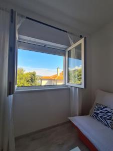 Postel nebo postele na pokoji v ubytování Apartman Karmen