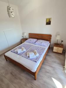 Postel nebo postele na pokoji v ubytování Apartman Karmen