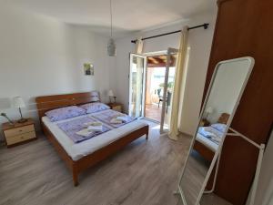 Postel nebo postele na pokoji v ubytování Apartman Karmen