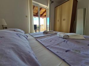 Postel nebo postele na pokoji v ubytování Apartman Karmen