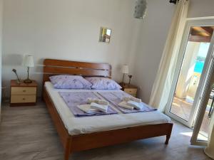 Postel nebo postele na pokoji v ubytování Apartman Karmen