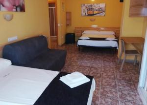 Postel nebo postele na pokoji v ubytování Hotel Alaska