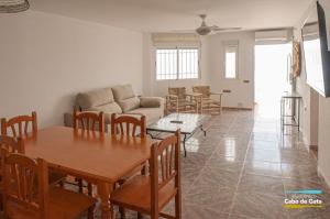 a living room with a table and a couch at LA CALILLA II in San José