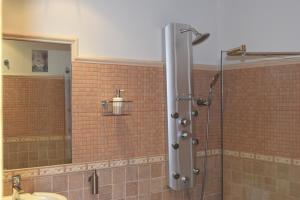 a bathroom with a shower with a glass door at Alborada del Eo in Vegadeo