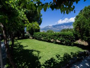 a garden with a view of a mountain at Studios Dimitra in Spartià
