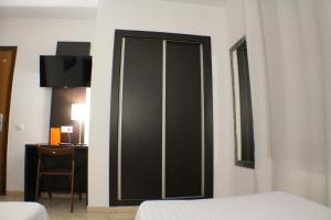 Cama o camas de una habitación en Hotel Marfany