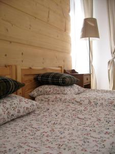 a bedroom with two beds with pillows on them at Studio 4U Zakopane APARTZAKOP in Zakopane