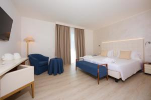 Postel nebo postele na pokoji v ubytování Hotel Bauer & Sporting