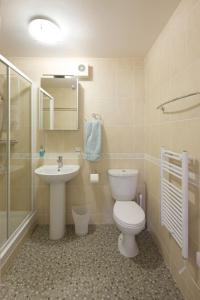 a bathroom with a toilet and a sink at tulips in Fort William