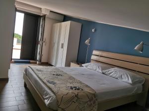Postel nebo postele na pokoji v ubytování villa peppino