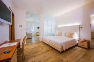Postel nebo postele na pokoji v ubytování Hotel Bauer & Sporting