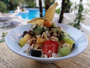 a plate of food on a table with a salad at Mamboo Hotel Cala Ratjada in Cala Ratjada