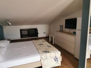 Postel nebo postele na pokoji v ubytování villa peppino
