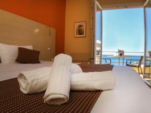Postel nebo postele na pokoji v ubytování Janus Hotel