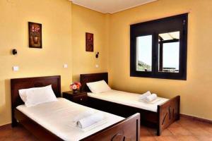 Ένα ή περισσότερα κρεβάτια σε δωμάτιο στο Makronas Apartments