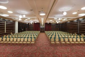 an empty room with chairs in a building at Hotel International Iasi in Iaşi +52 photos