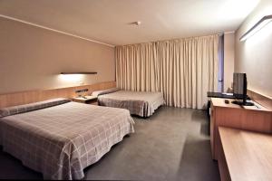 Postel nebo postele na pokoji v ubytování Hotel Acuazul
