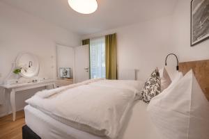 Postel nebo postele na pokoji v ubytování Appartements Prunner
