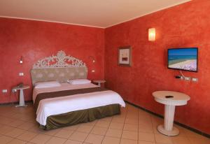 Postel nebo postele na pokoji v ubytování Janus Hotel