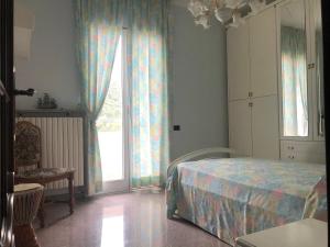 Ένα ή περισσότερα κρεβάτια σε δωμάτιο στο Villa alle Marixe