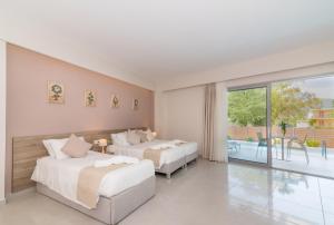 Voodi või voodid majutusasutuse Poseidon Beach Hotel toas