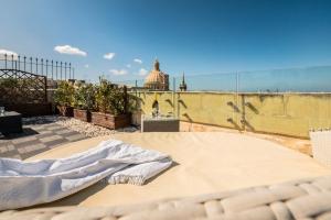 a mattress laying on top of a roof at La Vallette in Valletta