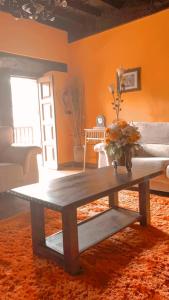 a living room with a coffee table and a couch at La Corrolada in Avín +39 photos