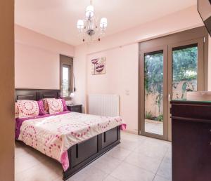 Postel nebo postele na pokoji v ubytování Villa Olive Tree + 37 fotografií