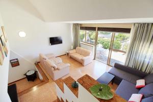 an overhead view of a living room with a couch and chairs at Villa Cuckoo's Nest in Finale Ligure