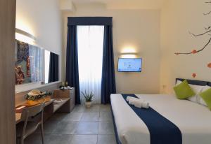 
Ein Bett oder Betten in einem Zimmer der Unterkunft Suites Farnese Design

