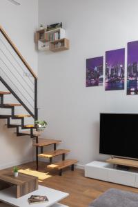 Televízia a/alebo spoločenská miestnosť v ubytovaní Metily apartment