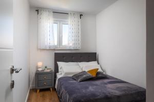 Posteľ alebo postele v izbe v ubytovaní Metily apartment