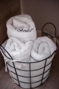 a basket filled with towels sitting on a table at Boutique 23 in Douăzeci şi Trei August +54 photos