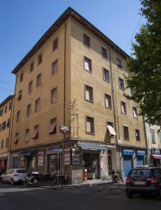 a large building on the corner of a street at Luxurio rooms with baths in Livorno