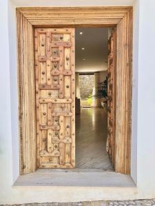 an open wooden door in a room with at Casa Celeste in Alicante