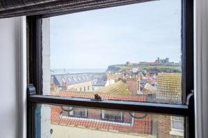 a view of a city from a window at Jet Black Jewel in Whitby