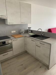 Kuchyň nebo kuchyňský kout v ubytování Apartment Bel-Air