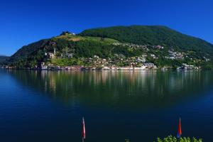 an island in the middle of a large body of water at Zappa Lake Lodge in Brusino Arsizio