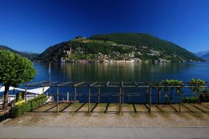a view of a body of water with a mountain at Zappa Lake Lodge in Brusino Arsizio