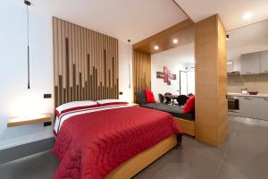 En eller flere senge i et værelse på Il Rubino Holiday House