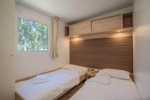 Cama o camas de una habitación en Mobile Homes Delta Marine at Campsite Lopari