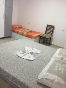 Katil atau katil-katil dalam bilik di Eriola apartament