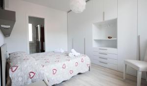 Postel nebo postele na pokoji v ubytování Casa Rosa Dei Venti