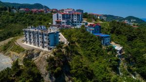 a group of buildings on top of a hill at Amasra Sunrise Otel in Bartın
