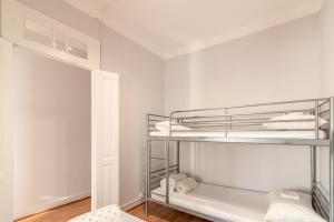 a walk in closet with bunk beds in a room at Albergue Casa de Abreu in Redondela