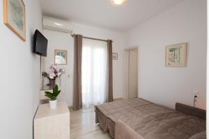 Postel nebo postele na pokoji v ubytování Hotel Spanelis
