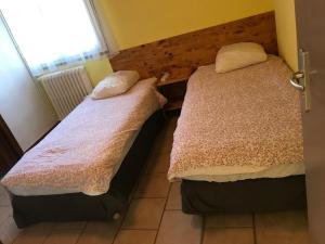 Postel nebo postele na pokoji v ubytování Le Serre Chevalier Maison Familiale