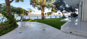 a walkway in a house with a view of the water at Tzeni Villa in Lygia