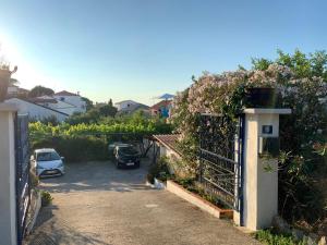 a parking lot with cars parked on the street at Danijela in Mali Lošinj +21 photos